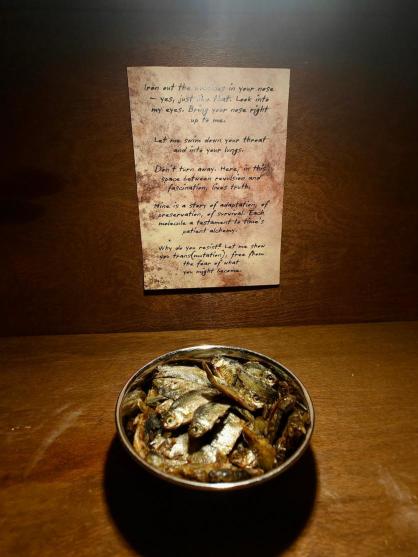 Installation view with poems mounted on weathered doors