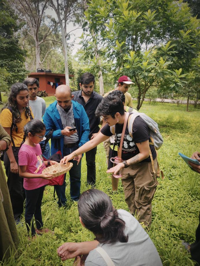 Workshop participants collaborating at a table with papers and notes